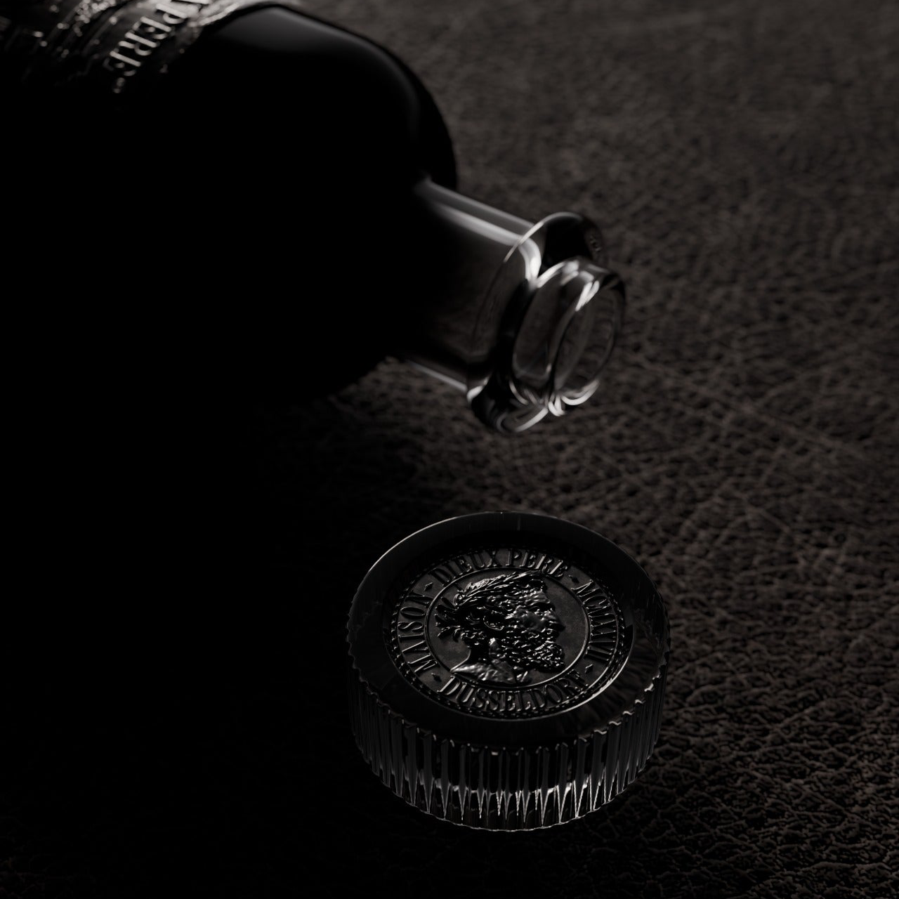 Detail of the Maison Dieux Père glass stopper and medallion on the vodka macérat bottle.