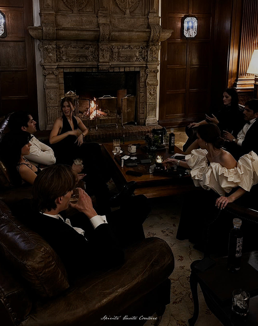 Guests enjoying Maison Dieux Père during a private evening by the fireplace in Munich.