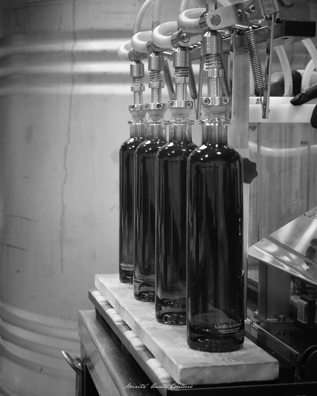 Maison Dieux Père vodka macérat bottles during the bottling process.