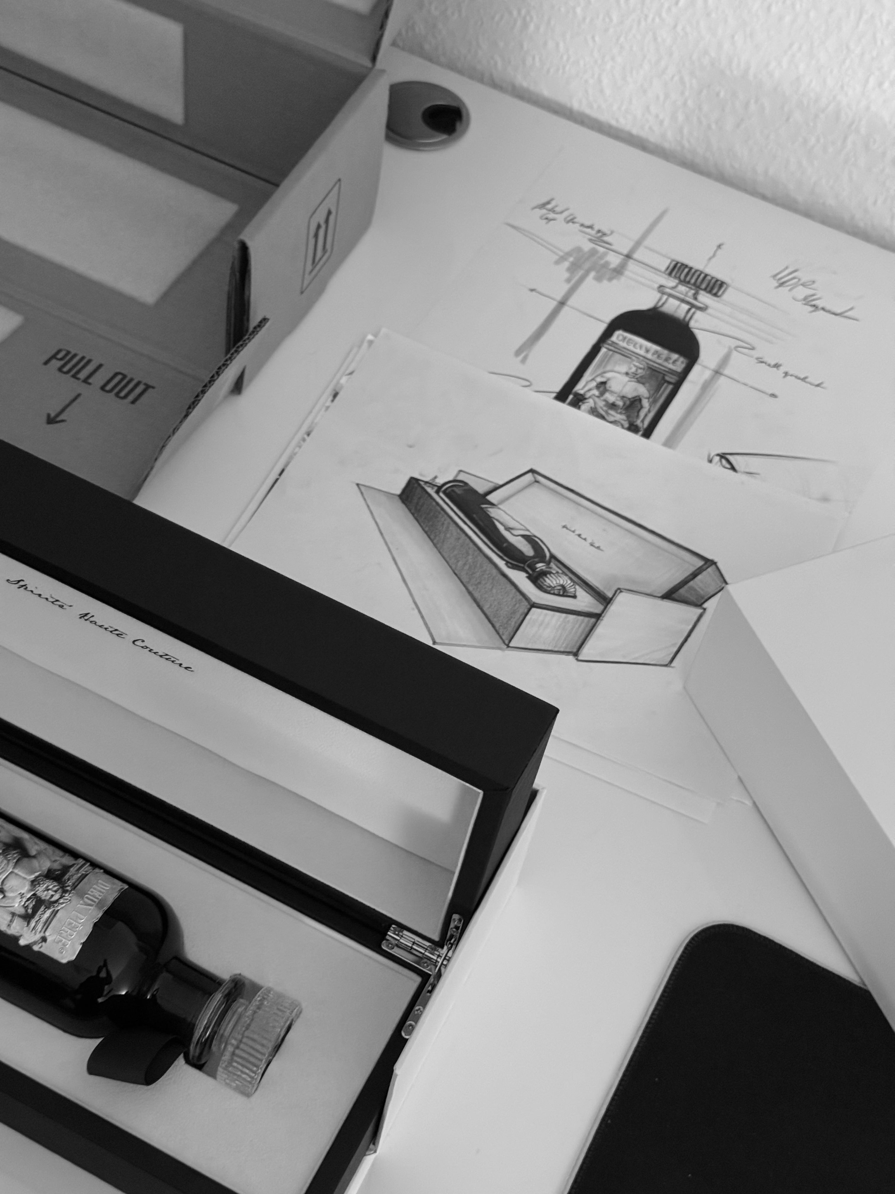 Maison Dieux Père bottle and packaging prototype with design sketches.