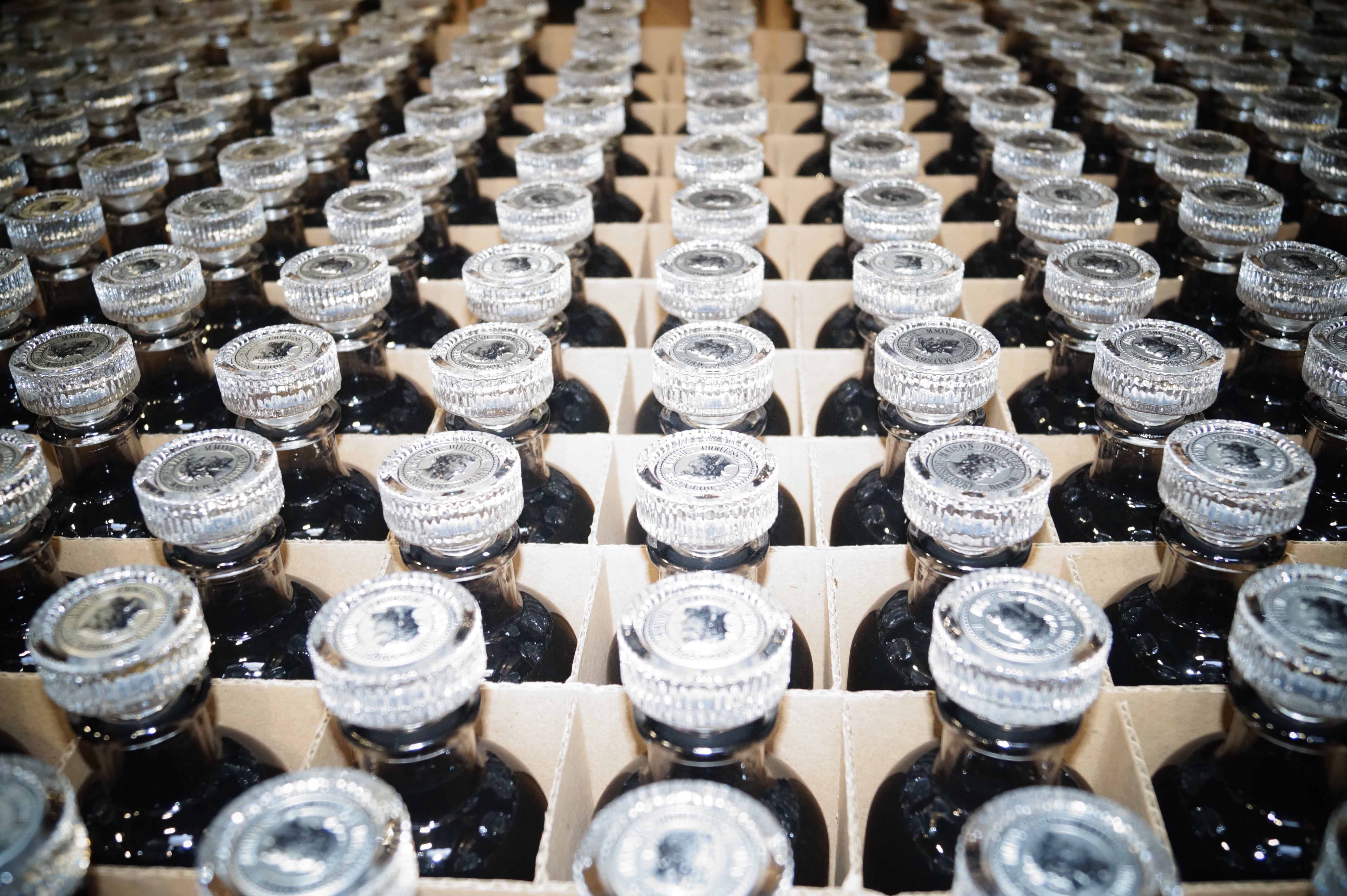 Maison Dieux Père vodka macérat bottles prepared for private concierge requests.